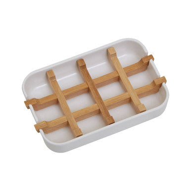 White ceramic soap dish with light brown bamboo grid insert perfect for holding white soap and keeping it dry