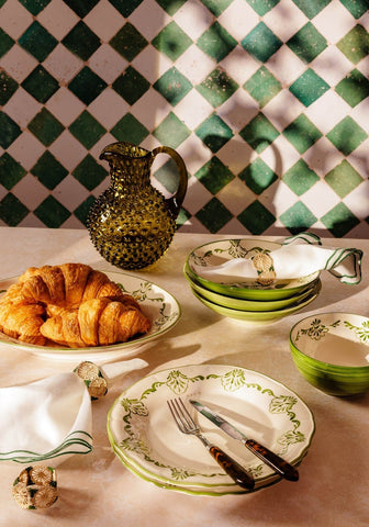 Green and white ceramic cara shell serving bowl with leafy green patterns perfect for stylish table settings