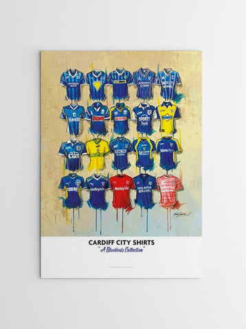 A framed limited edition print showing cardiff city football shirts in various colors on a beige background