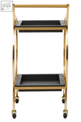 Gold finished metal serving trolley with two tier black faux shagreen trays and caster wheels for easy mobility