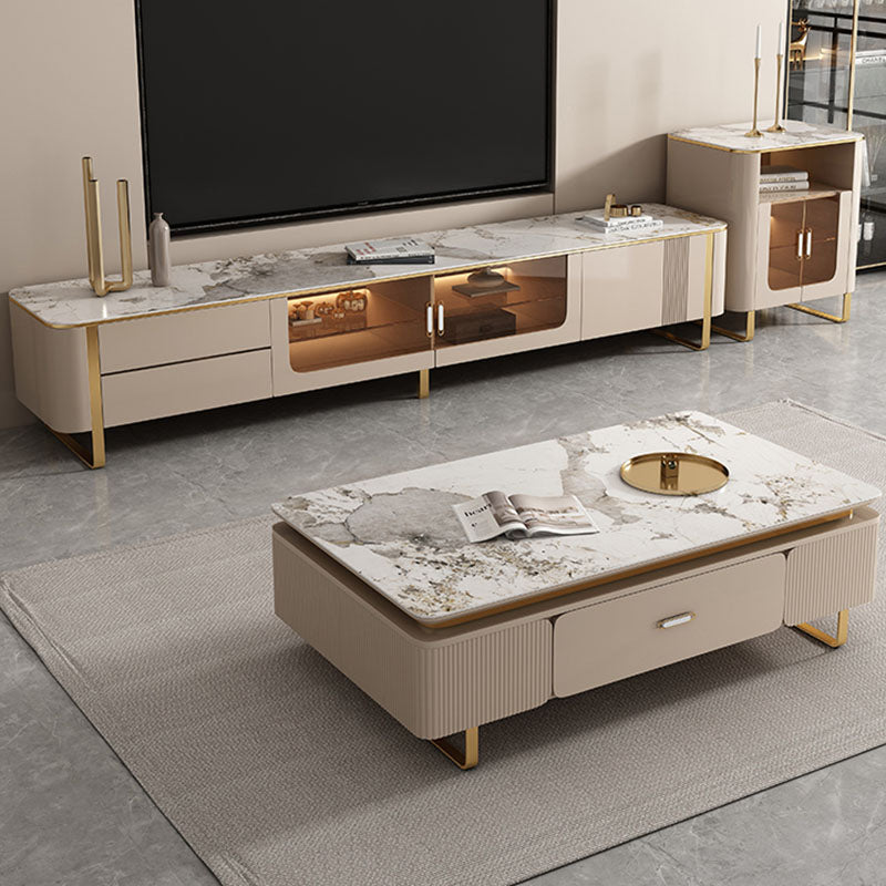 Beige marble-top carl rectangle coffee table with gold legs and drawers in a modern carl living room set design