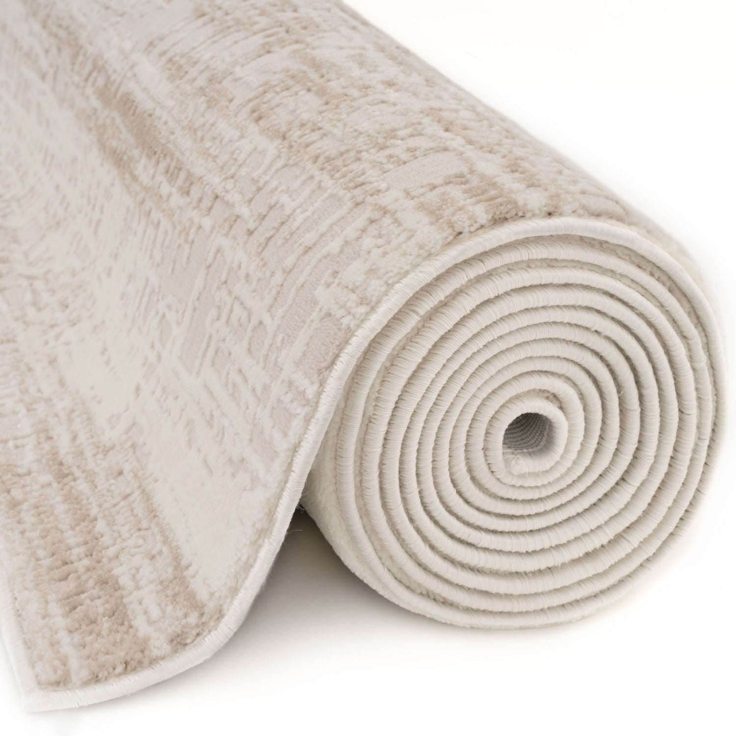 A rolled carmel cream-beige abstract rug with a textured woven pattern and soft pile