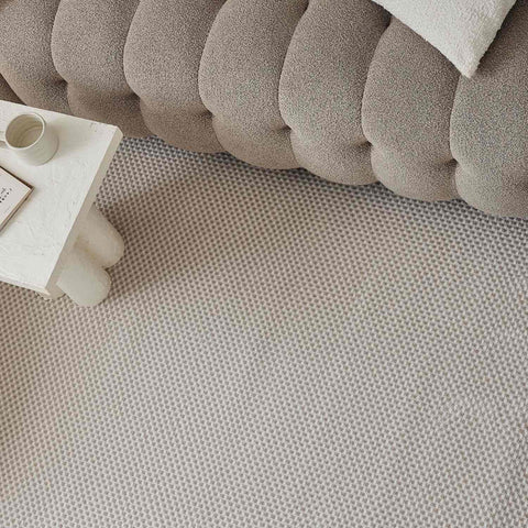 Beige textured area dots rug with a subtle geometric pattern perfect for cozy home decor in cream-beige tones