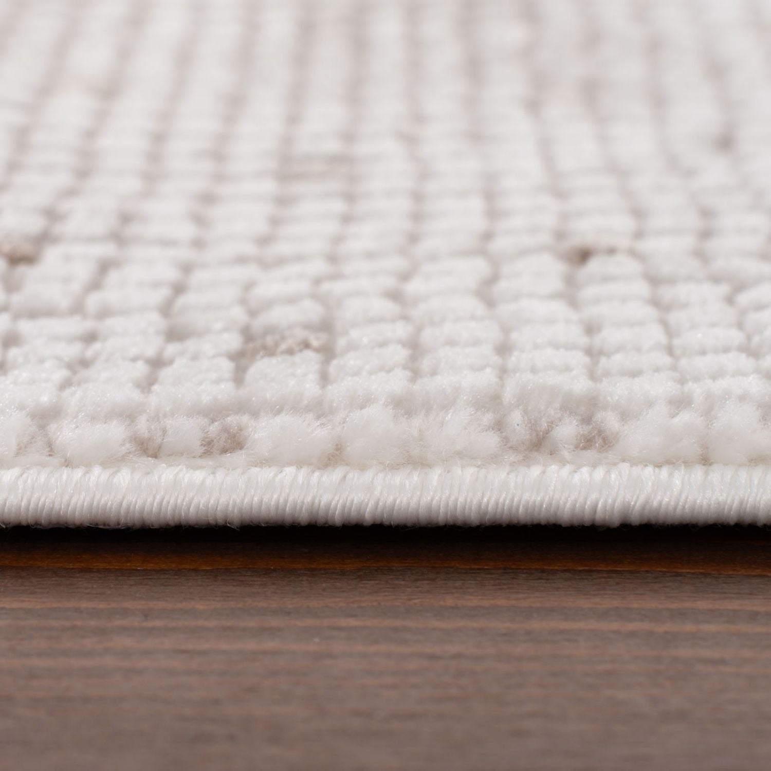 White textured carmel cream beige dots rug with woven raised pattern and neatly finished edge for cozy spaces