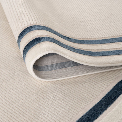 Cream-colored corduroy bordered rug with navy blue stripes carmel cream-blue bordered rug 6060