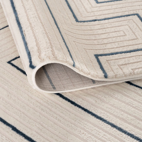 Cream-colored geometric rug with navy blue textured patterns carmel cream-blue geometric rug 6040