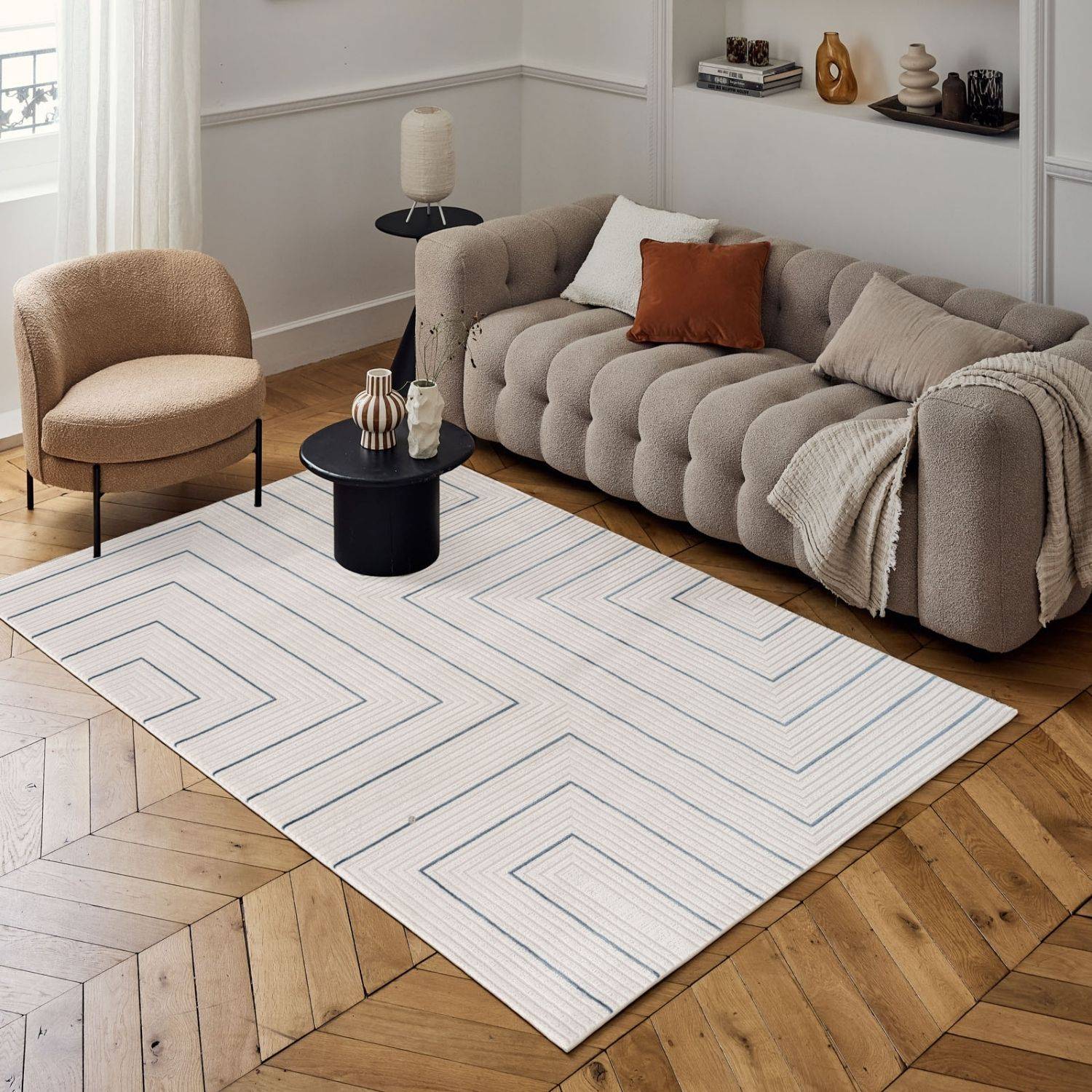 Modern geometric rug with white base and black angular maze design in carmel cream-blue geometric style