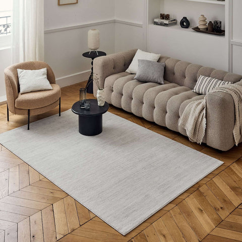 Light gray rectangular striped rug with subtle textured weave perfect for living room or bedroom decor