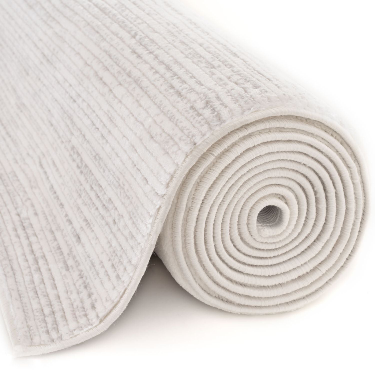 A soft off-white carmel cream-grey striped rug with a textured ribbed pattern and plush looped pile