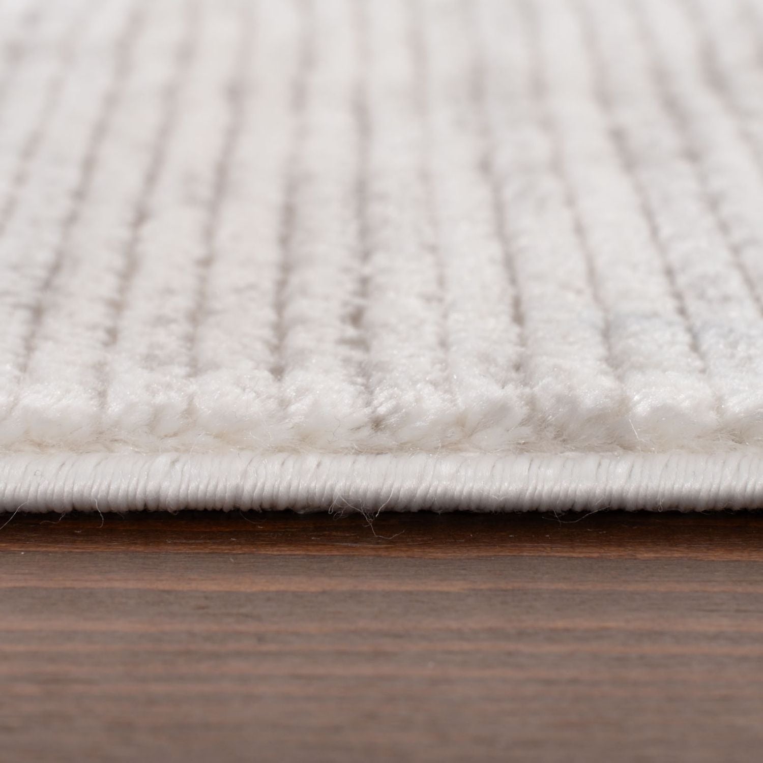 Carmel cream-grey striped rug with white textured ribbed pattern and neatly finished edge ideal for cozy spaces