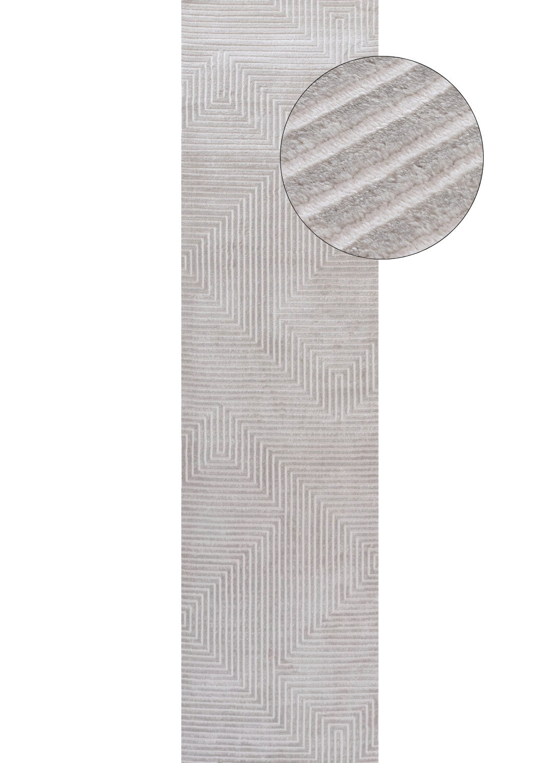 A light gray and cream geometric rug with raised textured zigzag lines perfect for modern living spaces