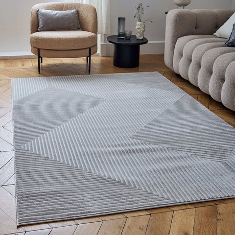 Gray geometric rug with cream accents featuring a textured ribbed design perfect for modern living spaces