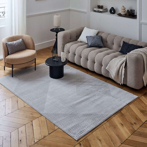 Gray cream geometric rug with a textured ribbed surface perfect for stylish modern living spaces