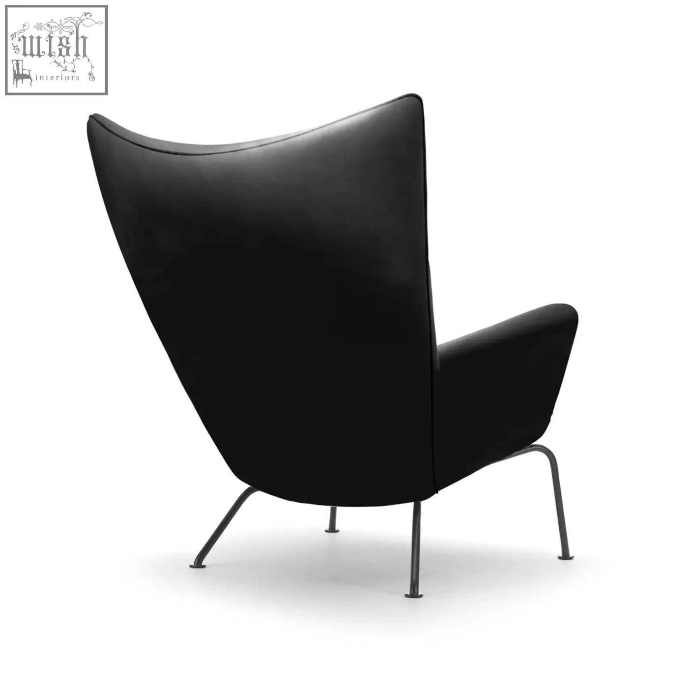Black leather carnaby high back armchair with ottoman featuring sleek metal legs and selected high-density elastic foam