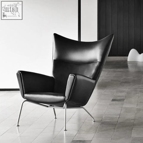 Black leather carnaby high back armchair with ottoman features selected high-density elastic foam and chrome legs