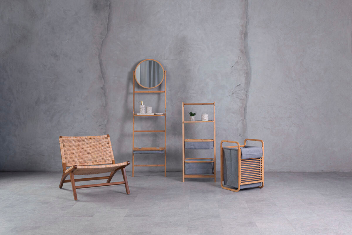Woven rattan chair with wooden frame shown next to carrick 3 tier storage unit with grey fabric shelves