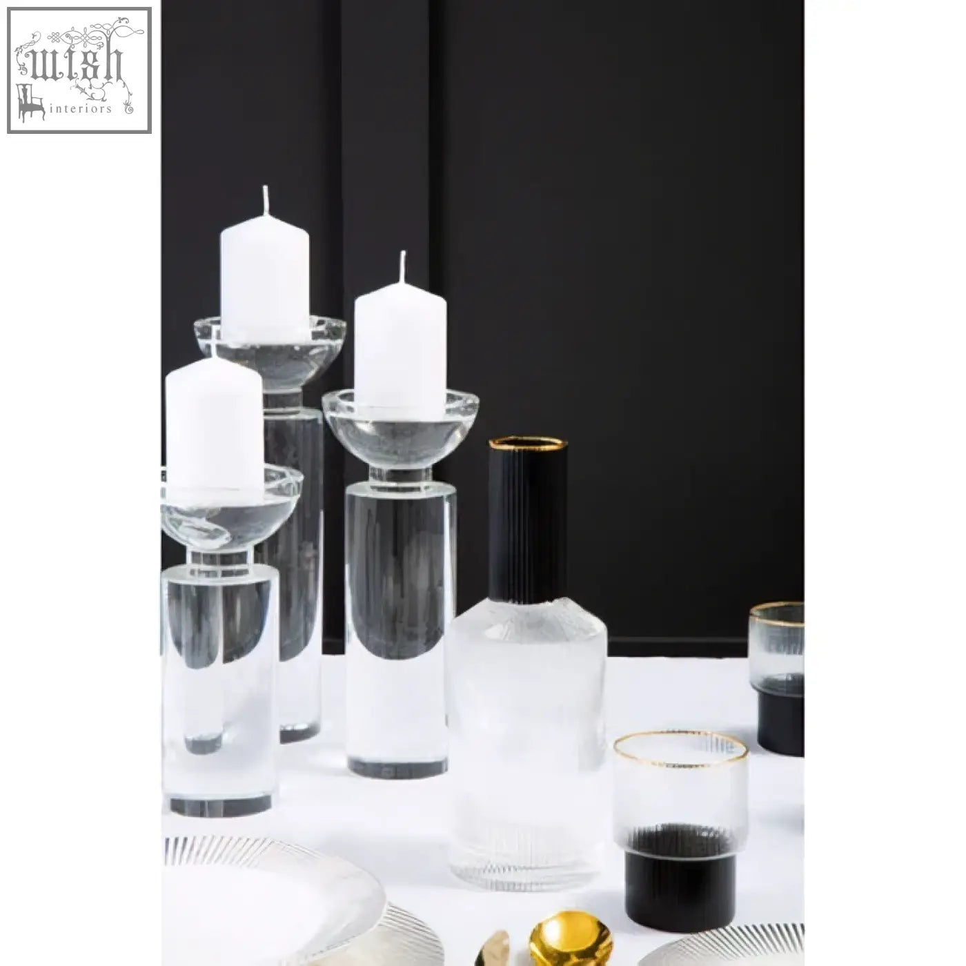 Carrie small crystal candle holder with clear glass, black accents, and gold rims in a modern minimalist display