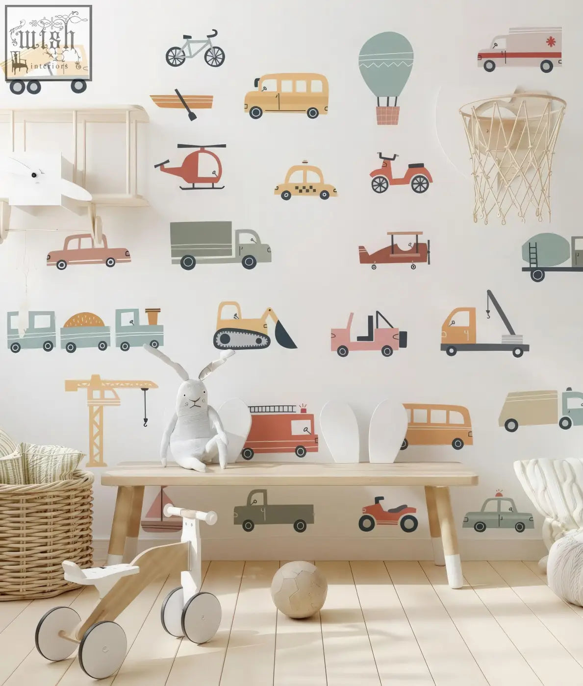 A white plush rabbit toy with long ears sitting on a bench with trucks wall decals for kids room decor