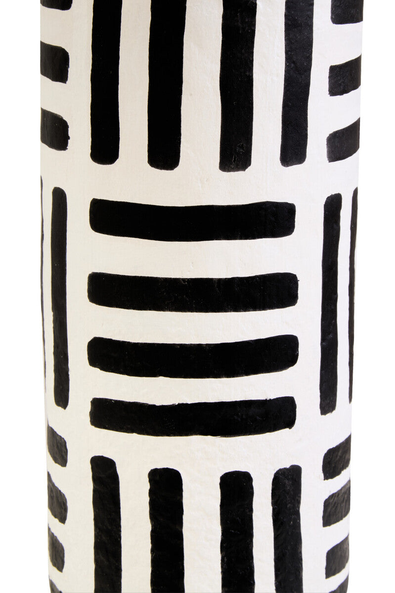 Carta black and white papier mache table lamp with geometric lines and a black and white patterned ceramic vase