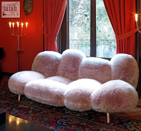 A carter three seater sofa in soft pink faux fur with rounded cushions and light legs offering financing options