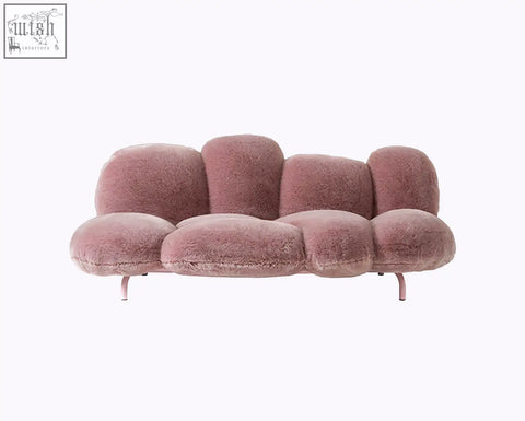 A mauve carter three seater sofa with fluffy cloud design and soft fuzzy upholstery available with offer financing and low shipping cost
