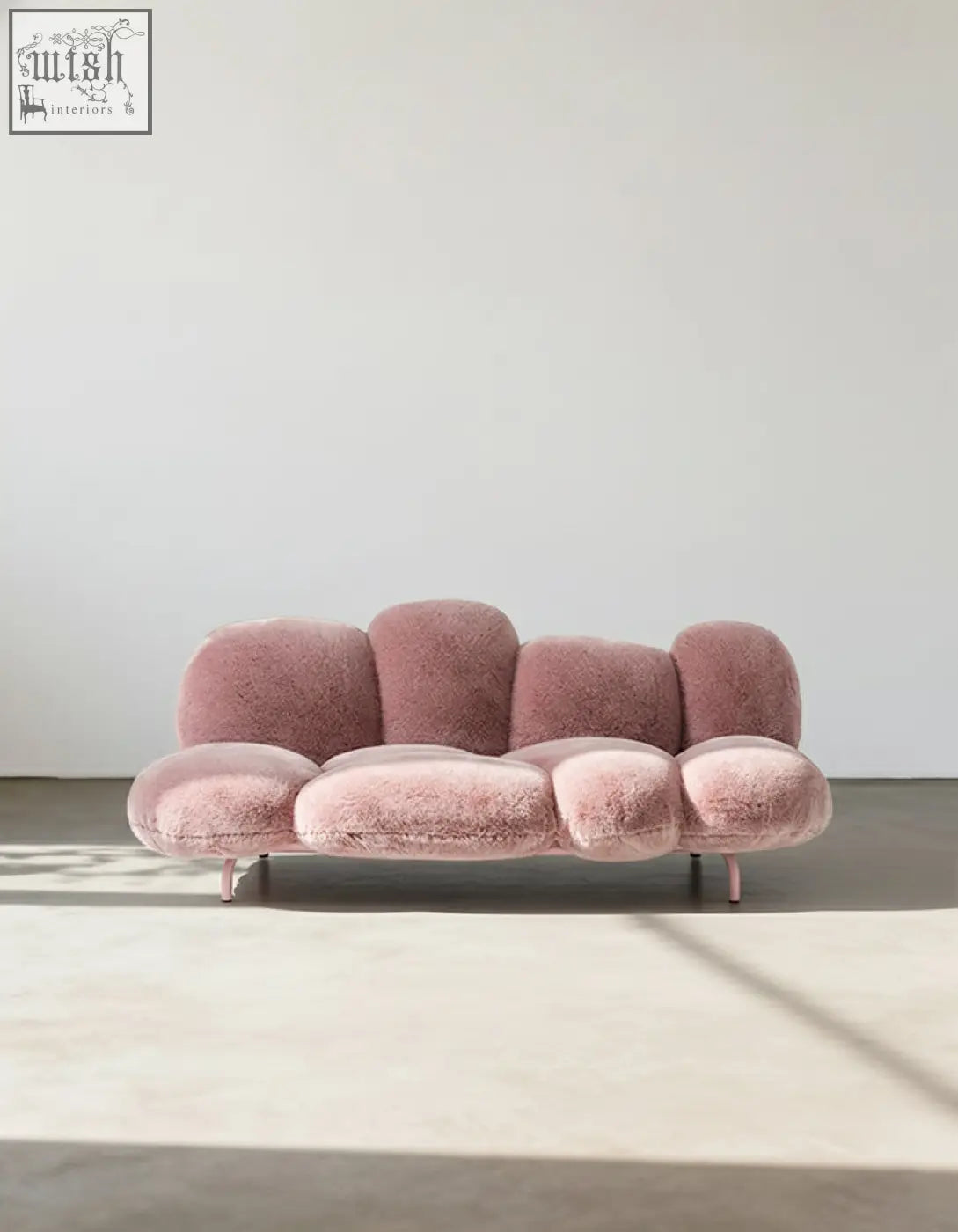 A plush pink carter three seater sofa with fluffy cloud design and slim metallic legs offer financing available