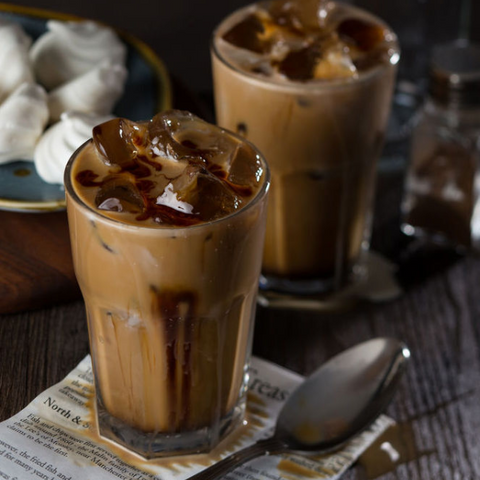Iced coffee in a clear glass with ice and dark syrup using casablanca water glasses 280ml set of 6