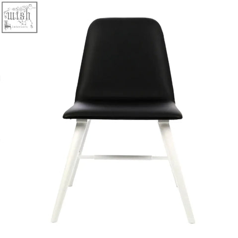 Black leather dining chair with sleek white legs featuring cassy black leather effect for modern dining spaces