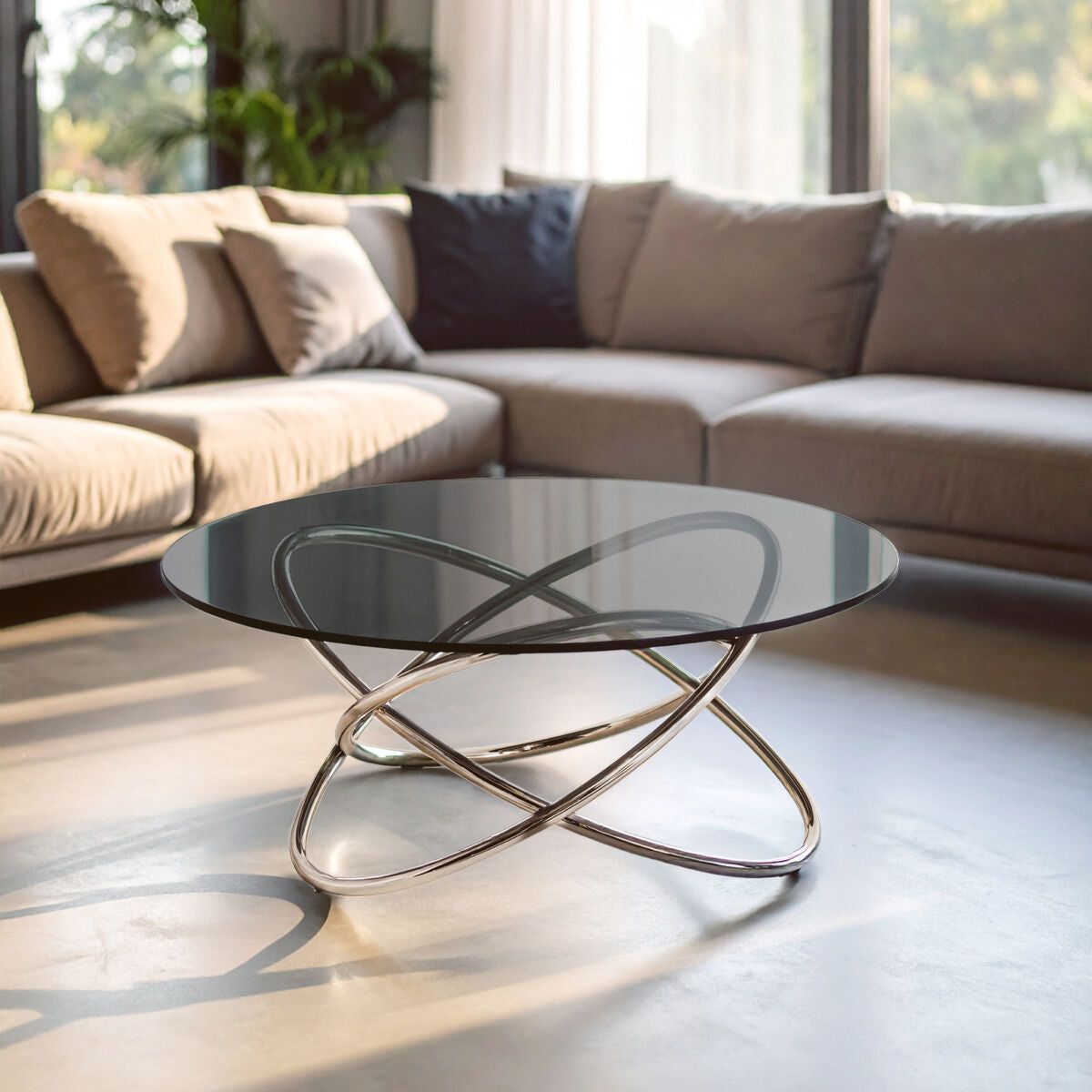 Modern chrome finished coffee table with sleek circular smoked glass top and intricate intersecting metal base