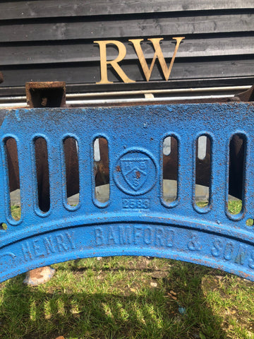 Blue cast iron reclaimed original henry bamford and sons table base with embossed branding and rusted metal accents