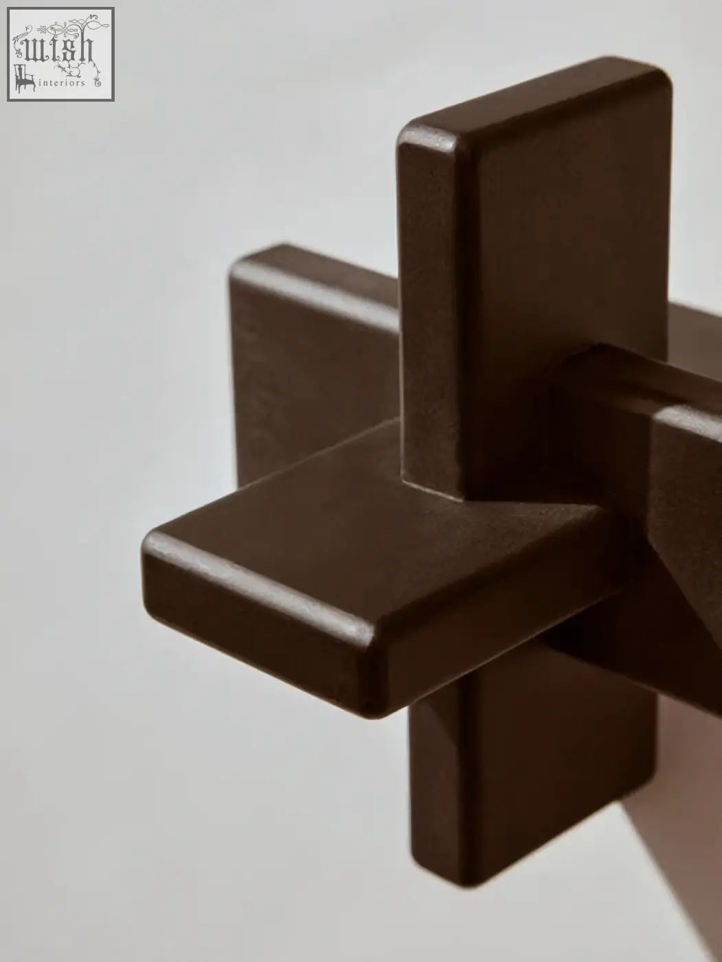 Dark brown matte metal cross decorative piece from cato black wood sculpture collection
