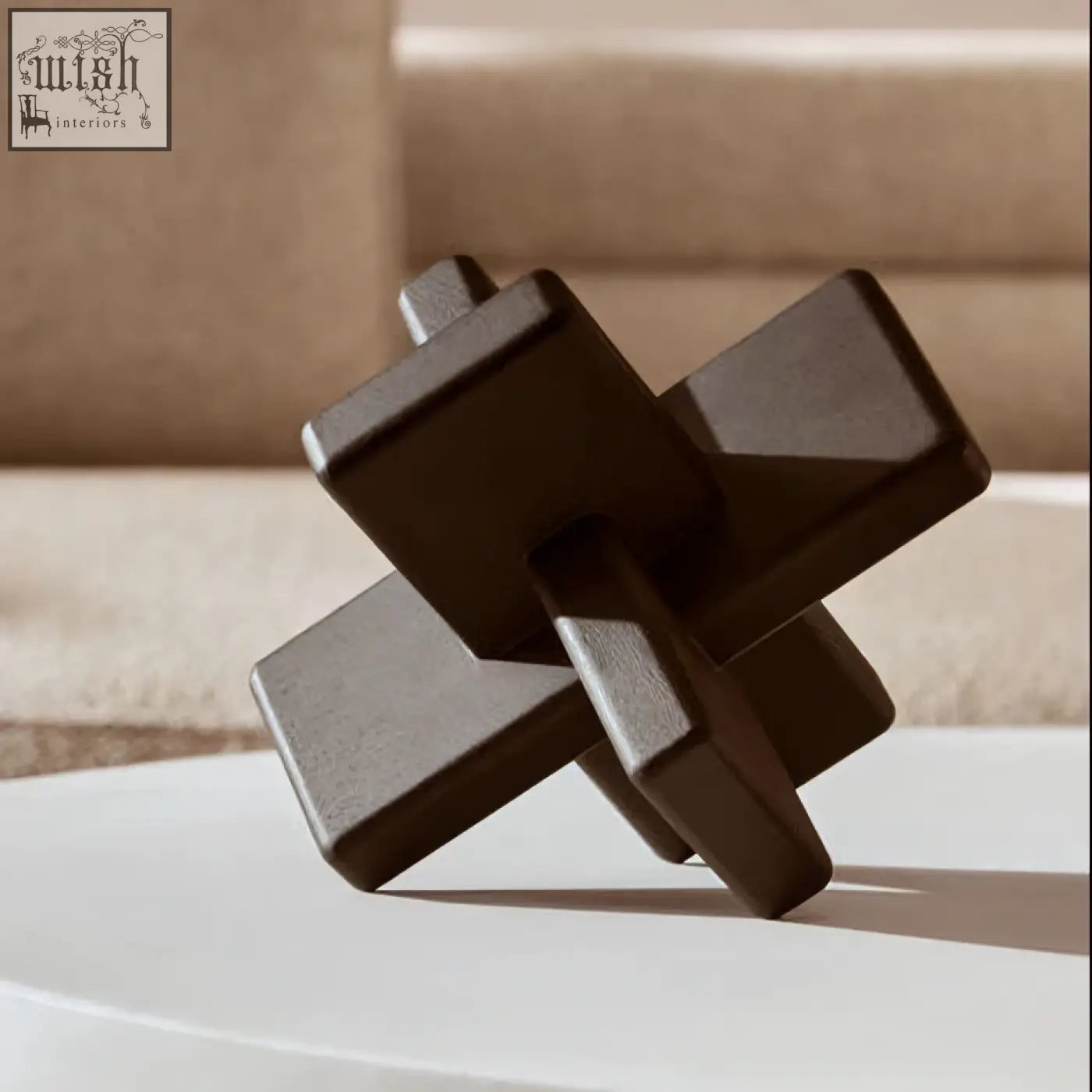 Dark gray ceramic geometric sculpture with intersecting square blocks in cato black wood sculpture design