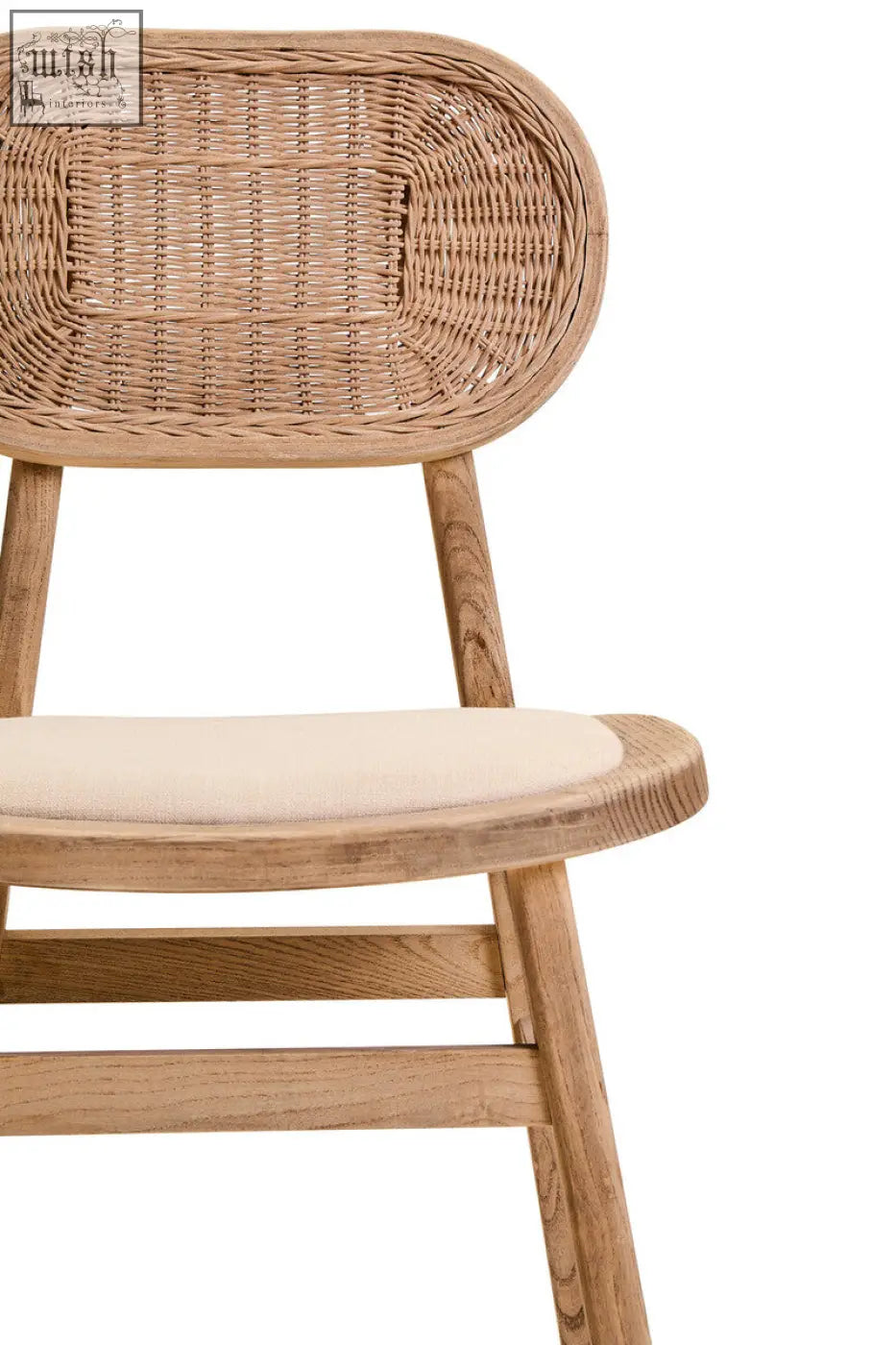 A dining chair with grey wash elm wood frame, woven rattan back, and cream cushioned seat perfect for dining rooms
