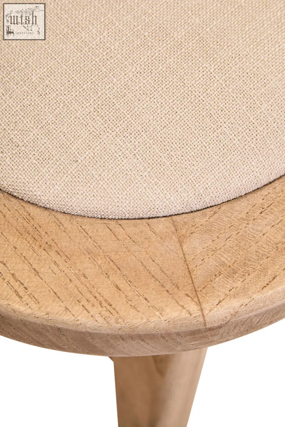 Beige woven fabric cushion on a grey wash elm wood stool of cebu beige fabric dining chair