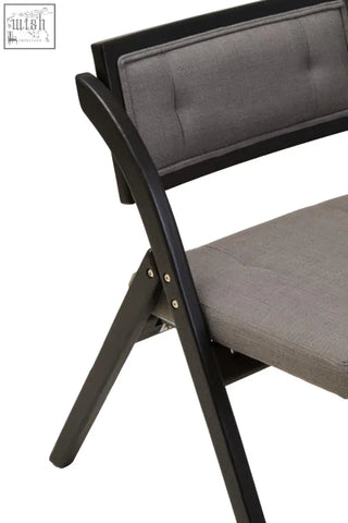Black elm wood folding chair with gray upholstered seat and backrest in a sleek black elm frame