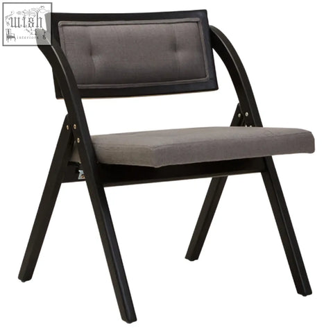 Black elm wood folding chair with gray upholstered seat and backrest in a sleek black frame