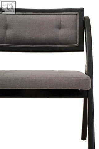 Modern black-framed bench with tufted gray fabric upholstery made of black elm wood from the cebu collection