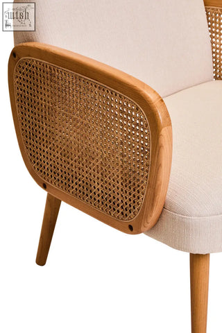 Beige upholstered cebu ivory fabric and cane chair with woven cane backrest and sturdy elm wood legs for comfortable seating