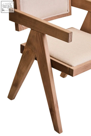 A modern wooden dining chair with grey wash beech wood frame and ivory fabric seat and backrest