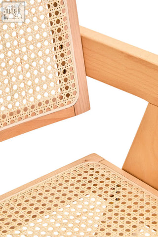 Light-colored wooden frame dining chair with woven natural cane seat and backrest cebu natural cane style