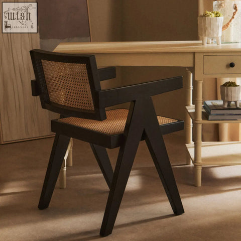 Black cane dining chair with angular frame and woven natural cane seat from cebu natural cane collection