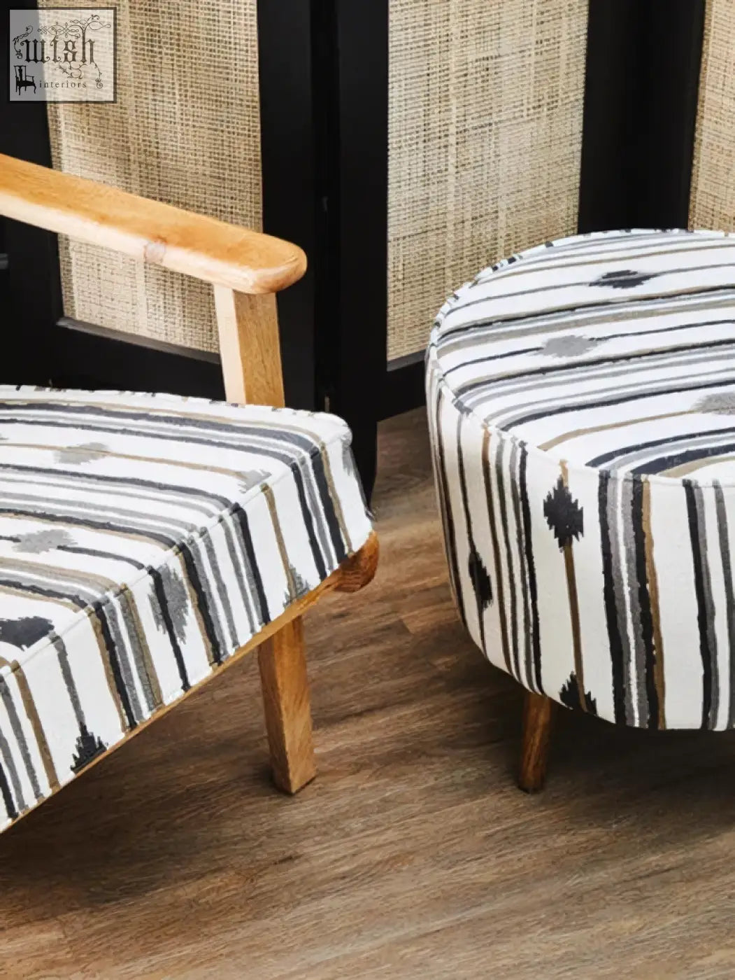 Black and white striped upholstered ottoman with wooden legs complementing cefena armchair with angular arms and white weave