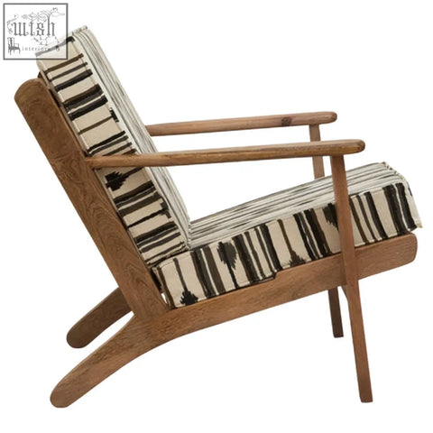 Cefena armchair with angular arms features a light wood frame and black and white weave striped upholstery