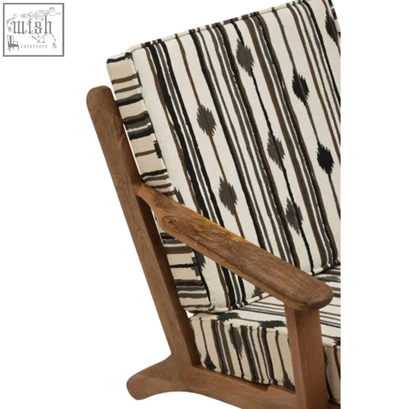 The cefena armchair features angular arms and black and white striped white weave upholstery with an ikat pattern