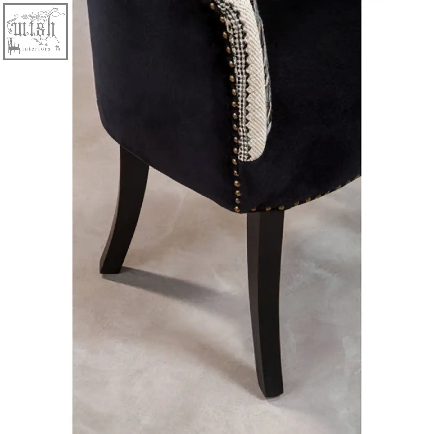 Cefena black and white chair with dark navy velvet, white beaded trim, sleek black wooden legs adds depth to your space