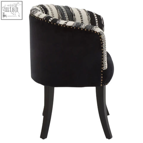 Cefena black and white chair with black velvet tufted backrest and metallic nailhead trim adds depth and style