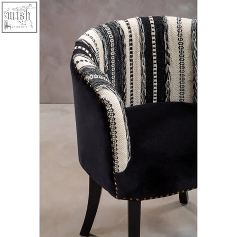 Black velvet cefena chair with striped fabric backrest and studded trim adds depth to your white chair collection
