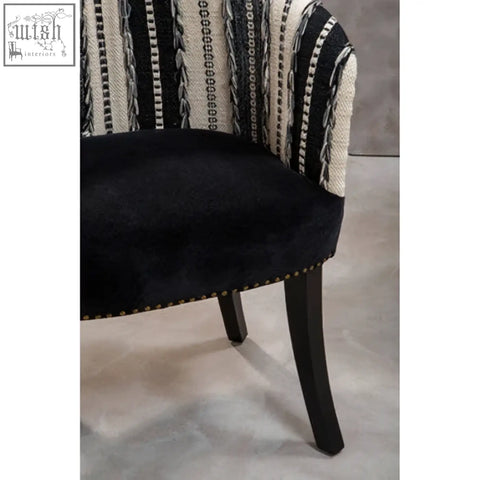 Cefena black and white chair with black velvet and white chair striped fabric adds depth with mango wood legs and nailhead trim