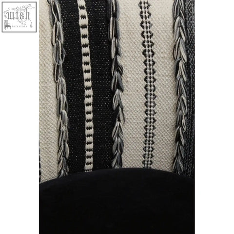 Cefena black and white chair with intricate woven textile adds depth to white chair made from mango wood