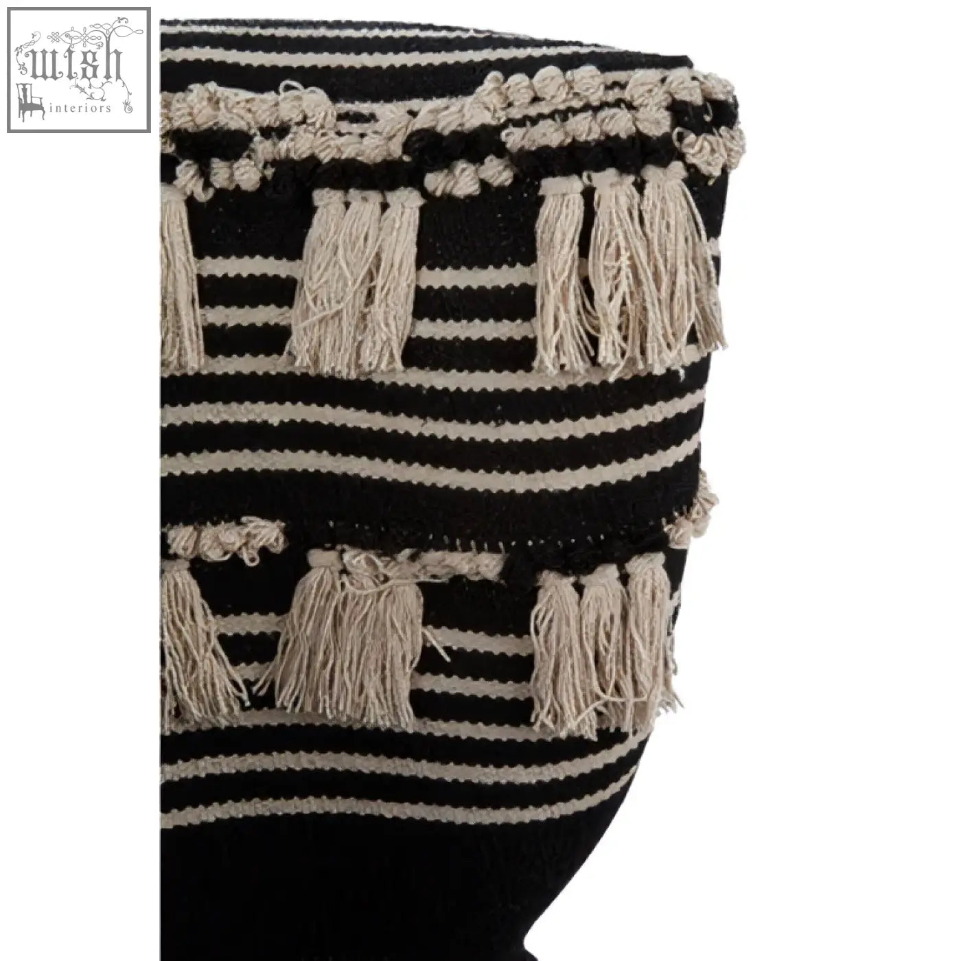 Black and cream striped knitted bag with tassel trim on cefena black moroccan chair for stylish storage